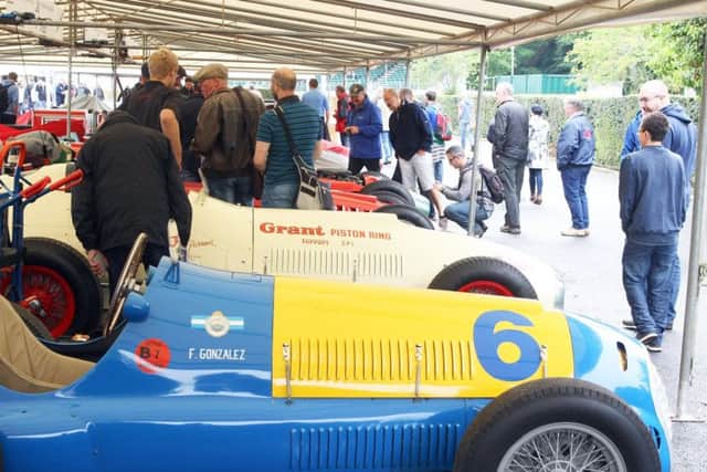 Vintage and modern cars are on display