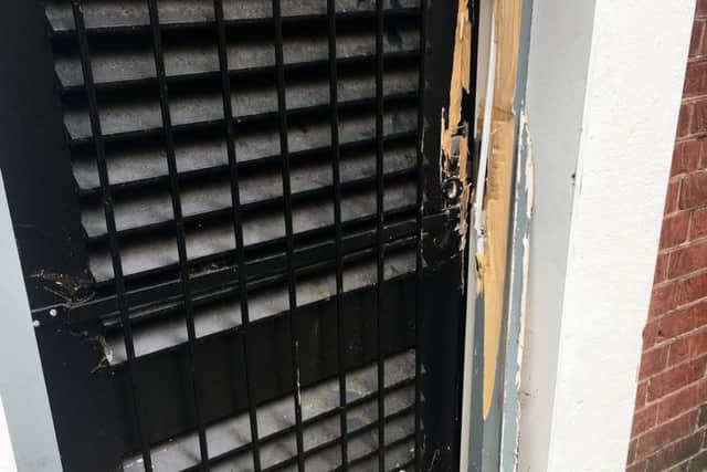 Damage to the back door at Dimples & Daisies