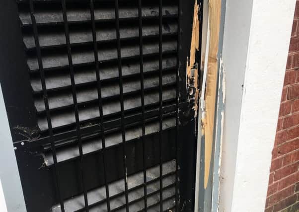 Damage to the back door at Dimples & Daisies