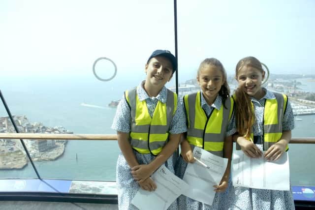 Anna Britchfield, Clara Beardall and Bryony Michael enjoy the view from the tower