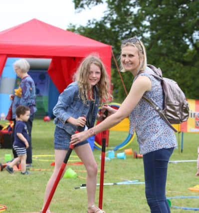 Mia Batt, nine, and Louise Batt learning circus skills at Stansted Garden Show, Rowlands Castle (171206)