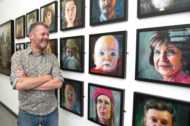 Karl Rudziak with some of his paintings at the We Don't Need Culture exhibition at the Somers Town Community Hub. 
Picture: Vernon Nash