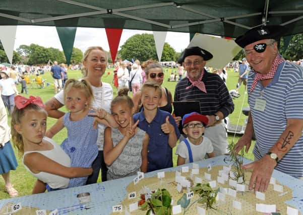 The Bedhampton Summer Show. Organisers Mike Sellis (left), and Ron Tate with Claire Hallawell (left), and family.
Picture Ian Hargreaves  (170748-1)