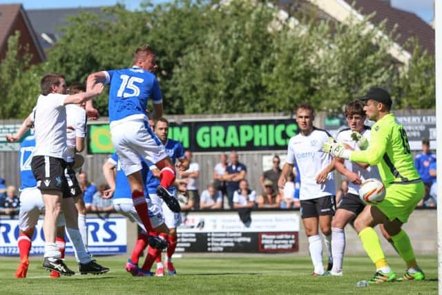 Tom Davies scores Pompey's second goal at Salisbury. Picture: Habibur Rahman