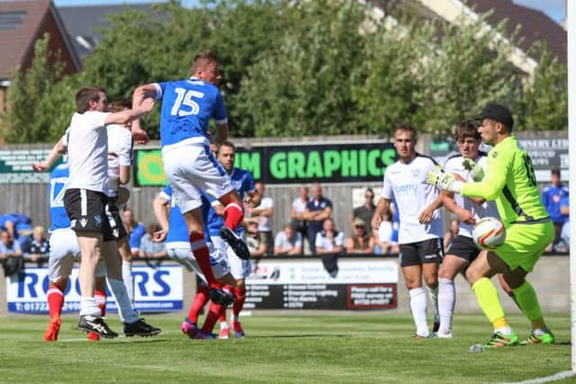 Tom Davies scores Pompey's second goal at Salisbury. Picture: Habibur Rahman