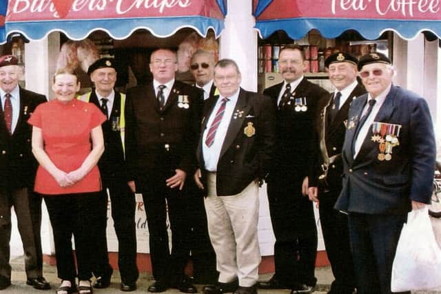 Hazel Pople with veterans at her seafront snack bar