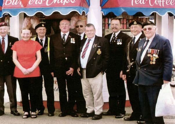 Hazel Pople with veterans at her seafront snack bar