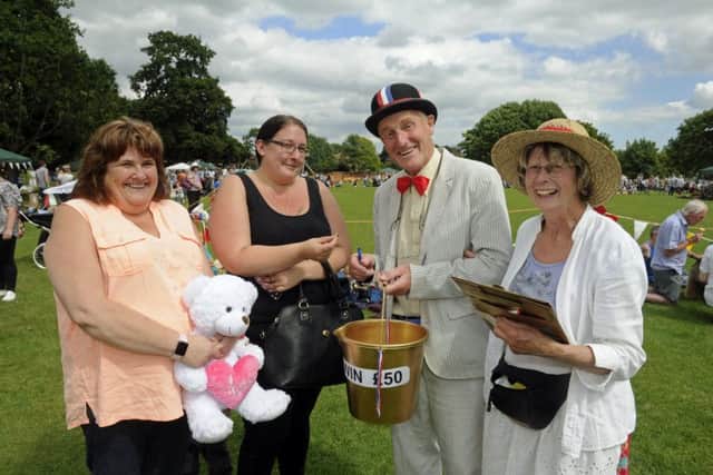 Residents Sandra Shorter and Vicki Fowler with Christine Reason and her husband George Reason and the golden bucket.Picture Ian Hargreaves  (170748-1) PPP-170107-190007006