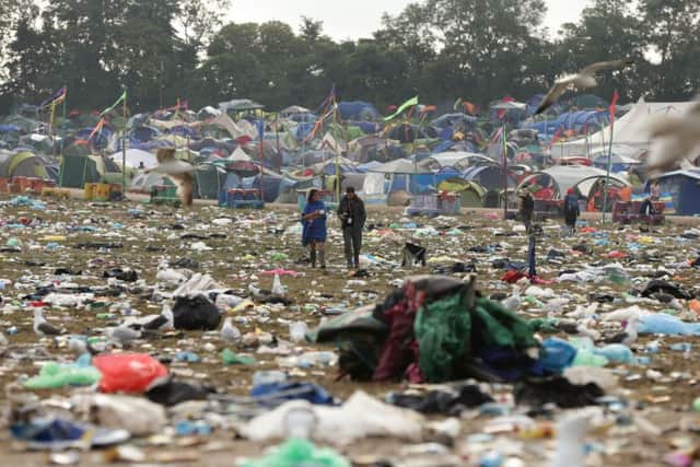 The litter strewn around the Pyramid Stage area as the clean up operation begins on site, at the Glastonbury Festival, at Worthy Farm in Somerset. PRESS ASSOCIATION Photo. Picture date: Monday June 30, 2014. Photo credit should read: Yui Mok/PA Wire YPN-140630-121400038