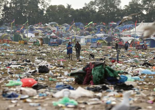 The litter strewn around the Pyramid Stage area as the clean up operation begins on site, at the Glastonbury Festival, at Worthy Farm in Somerset.  PRESS ASSOCIATION Photo. Picture date: Monday June 30, 2014. Photo credit should read: Yui Mok/PA Wire YPN-140630-121400038