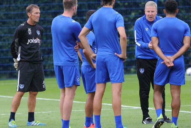 John Keeley, left, listens in as Kenny Jackett addresses the players Picture: Sarah Standing