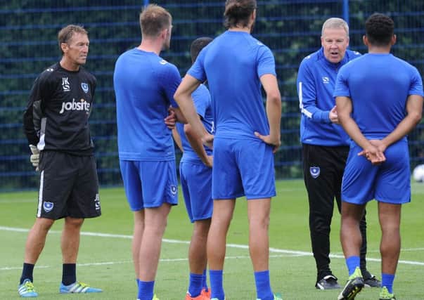 John Keeley, left, listens in as Kenny Jackett addresses the players Picture: Sarah Standing