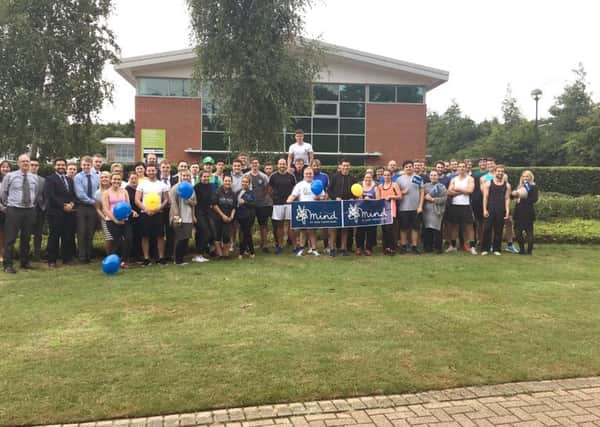 The Whiteley Onecom team celebrates raising Â£2,000