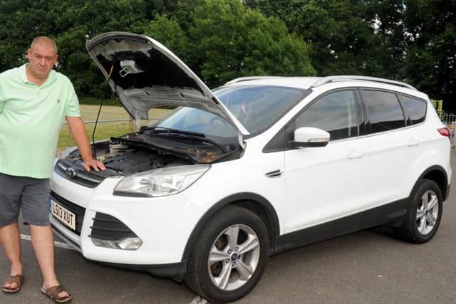 Mark Harrison with the  2013 Ford Kuga he bought from Waterlooville Car Supermarket in March 2017
Picture: Sarah Standing (170796-3974)