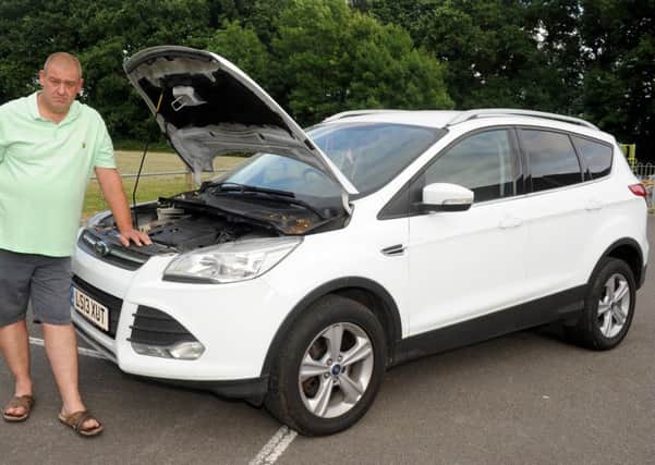 Mark Harrison with the  2013 Ford Kuga he bought from Waterlooville Car Supermarket in March 2017
Picture: Sarah Standing (170796-3974)