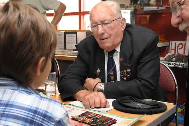 Jim Tuckwell describes his experiences to museum visitors in 2010