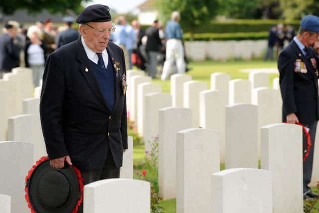 Jim Tuckwell pictured in 2009 at the grave of his best friend Jim Haydon who died on August 12, 1944