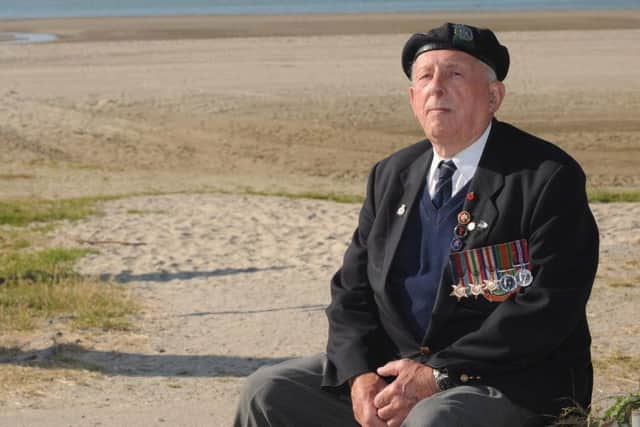 Jim Tuckwell on a Normandy beach when he returned to France with The News for the 65th anniversary commemoration of D-Day in 2009