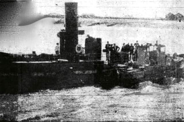 Evening News staff photographers photo of the Gosport ferry with the stricken craft (right) alongside.