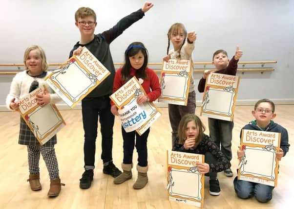 From left, Rose Waddington, 10, Max Ross, 12, Matilda Field, 10, Lucy Burfoot, 10, Isaac Nightingale, 10, with Megan Hartridge, 12, and Ethan Phillips, 10, kneeling