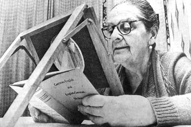 Jane Martin with the device she designed and made that will help short-sighted people with tasks such as reading and writing. 4675-1