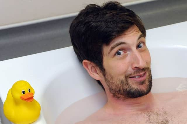 Reporter Tom Cotterillin his ice bath   Picture:  Malcolm Wells (170707-3419)