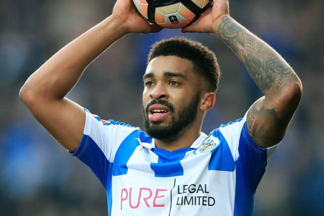 Tareiq Holmes-Dennis played 15 times for Huddersfield last season