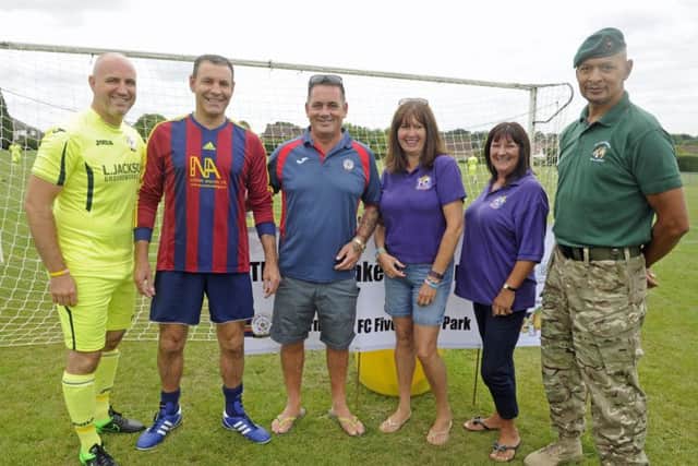 (L-r) Mark Stockley, Jon's brother Alan Hankey, organiser Lea Jackson, Pam Marshall and Sue Stokes of Hannah's Holiday Home and former Royal Marine Chris Falcke.  Picture: Ian Hargreaves  (170746-1)