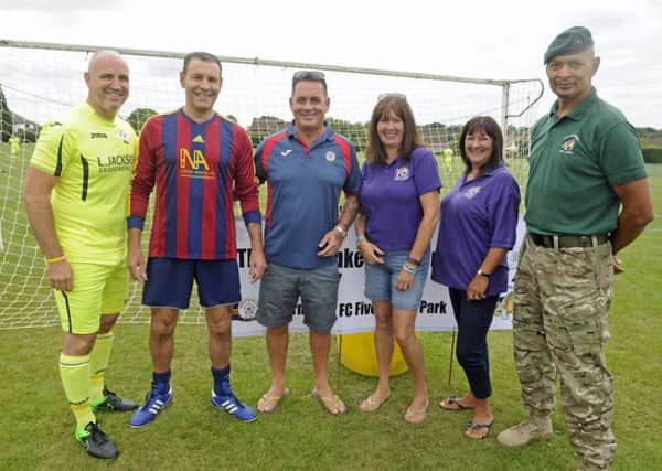 (L-r) Mark Stockley, Jon's brother Alan Hankey, organiser Lea Jackson, Pam Marshall and Sue Stokes of Hannah's Holiday Home and former Royal Marine Chris Falcke.  Picture: Ian Hargreaves  (170746-1)