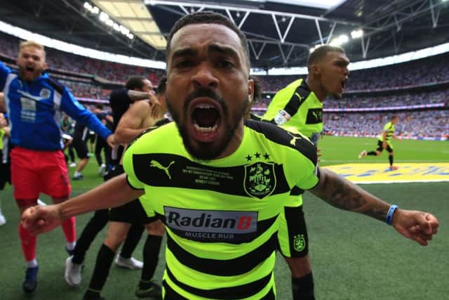 Tareiq Holmes-Dennis celebrates Huddersfields Championship play-off win against Reading at Wembley