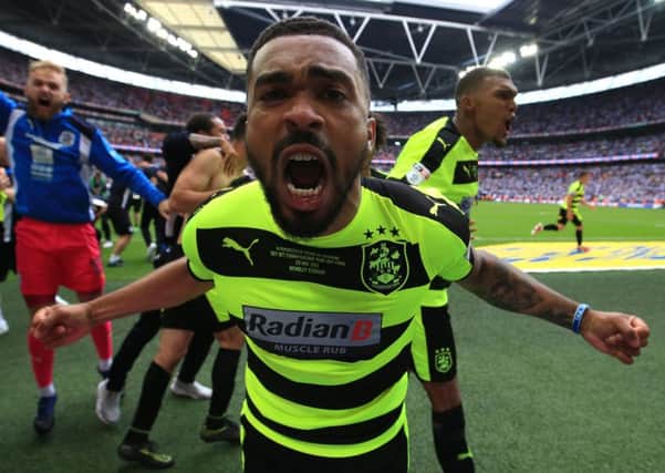 Tareiq Holmes-Dennis celebrates Huddersfields Championship play-off win against Reading at Wembley