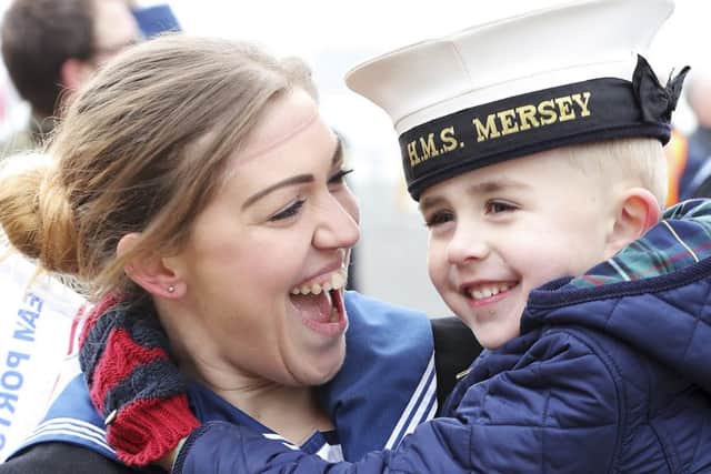 Rating Amy Binns with her son, Ethan Binns, aged five, after being deployed onboard HMS Mersey. Picture: Iggy  Roberts