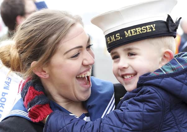Rating Amy Binns with her son, Ethan Binns, aged five, after being deployed onboard HMS Mersey. Picture: Iggy  Roberts