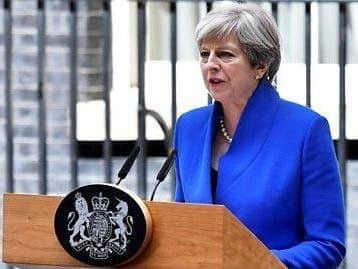 Theresa May the day after the General Election (PA picture) and, below, Rev Sean who believes there are benefits to failing