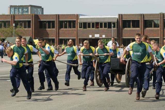 "HMS Collingwood's Victory Squadron cross the line to just win the competition
