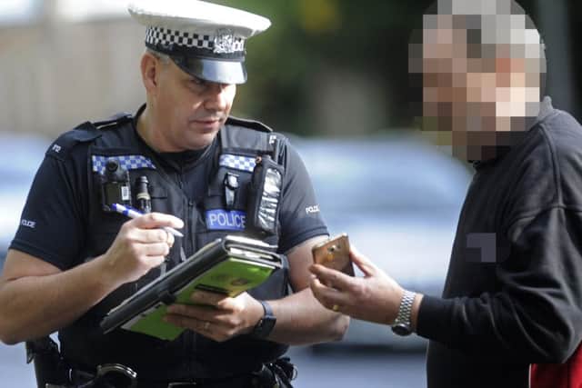 PC Mark Fruin speaks to a lorry driver caught on his phone in an operation last year. Picture: Ian Hargreaves PPP-161124-122557001