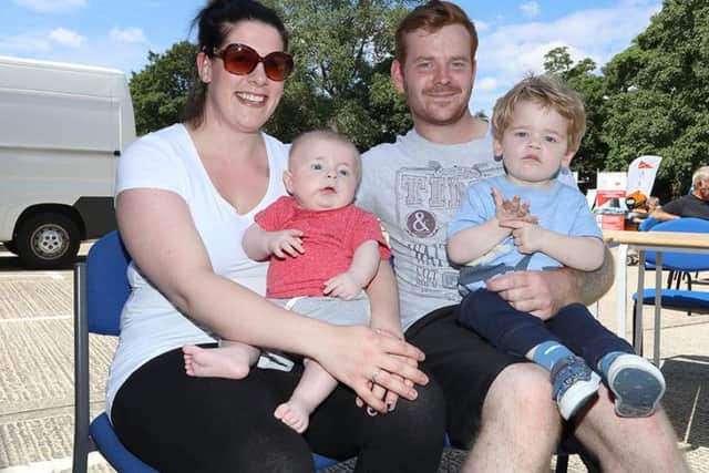 Kiki and Laurence Neal with their children at the Army Reserve Centre. Picture: Habibur Rahman