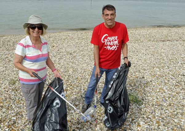 Vicky Bateman and Lewis Aliagh at the Lee-on-the-Solent beach clean-up  Picture: Ian Hargreaves  (170754-1)