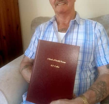 Adrian with some of the poems he has had bound, for his family