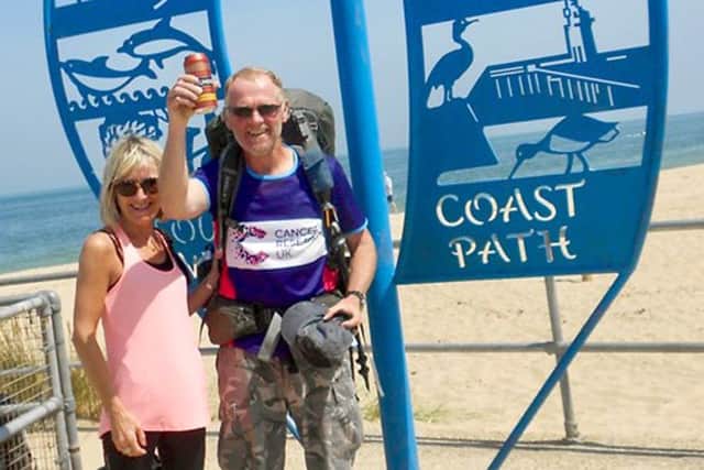 Tim's wife Lynn greets him at the end of his challenge