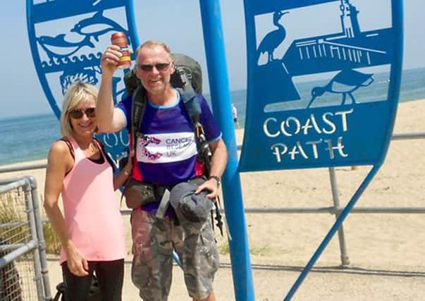 Tim's wife Lynn greets him at the end of his challenge
