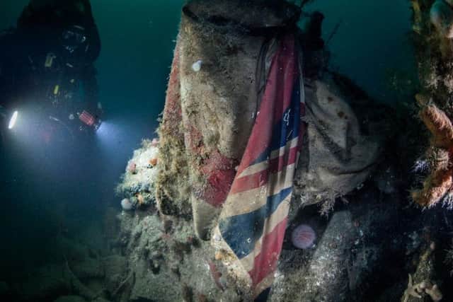 A Royal Navy diver at the wreck of HMS Vanguard
