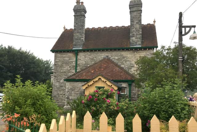 A picture postcard cottage at Corfe Castle railway station