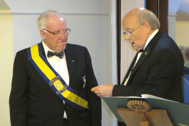 George Cantrill accepting the Sapphire Paul Harris Fellow from outgoing Rotary president Norman Chapman