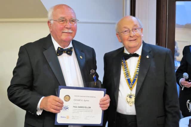 Gerry Ayres accepts his award from outgoing president Norman Chapman