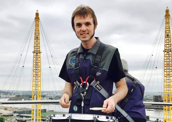 Drummer Nathan Hill on the roof of the O2 Arena  Picture: Talie Rose Eigeland