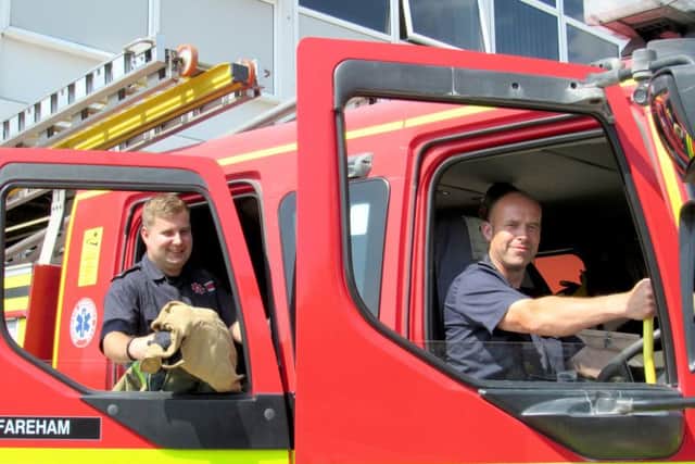 Firefighters James Voller, left, and Richard Cappell