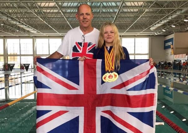 Nicole Mackenzie with her dad David (left) at the recent World Transplant Games.
