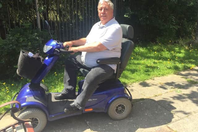Michael Close on his mobility scooter