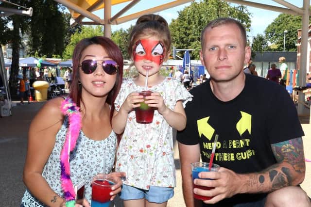 Jenny Yau, Alicia, four, and Paul Croager having lots of fun